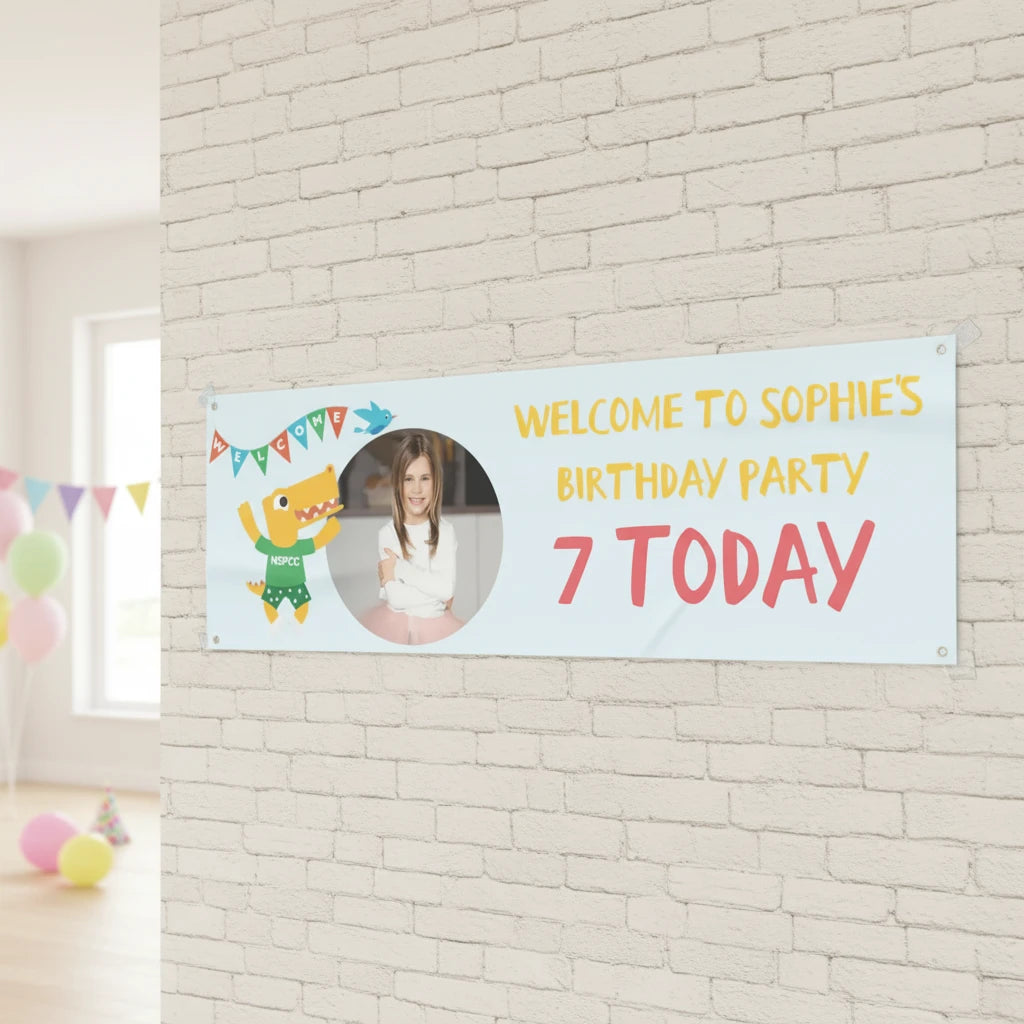 Official NSPCC Pantosaurus character, personalised baby blue banner, yellow and pink text with photo